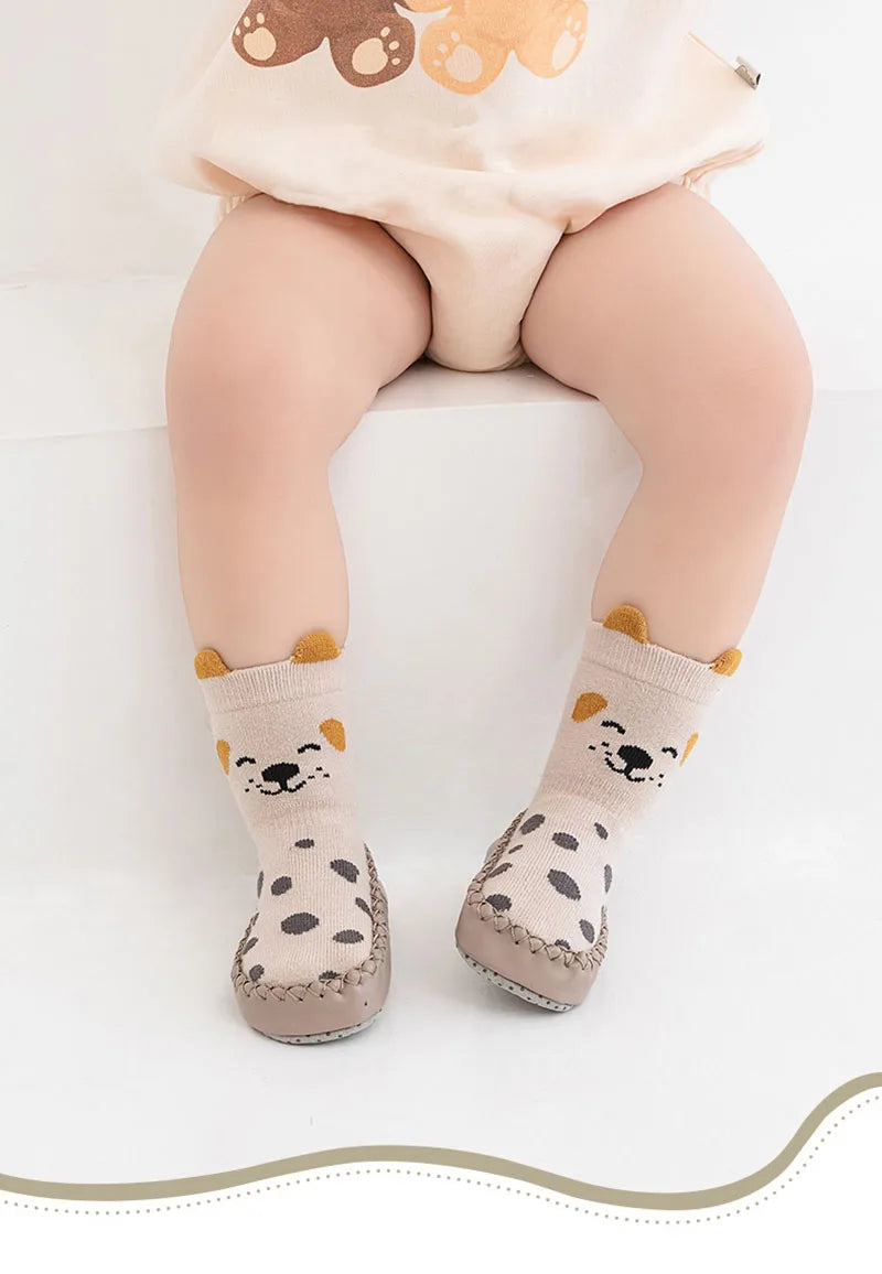 Pair of beige cartoon animal non-slip socks for babies and toddlers