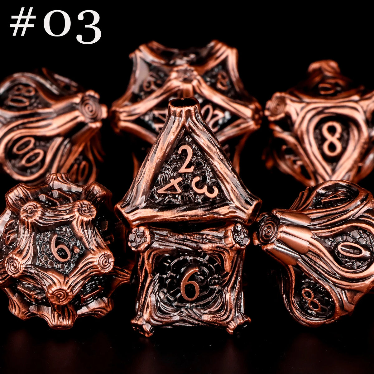 A set of seven polyhedral metal dice in a bronze or copper finish, arranged against a black background.