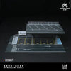 A 1:64 scale mini garage diorama featuring a dark gray model car parking area and overhead structure.