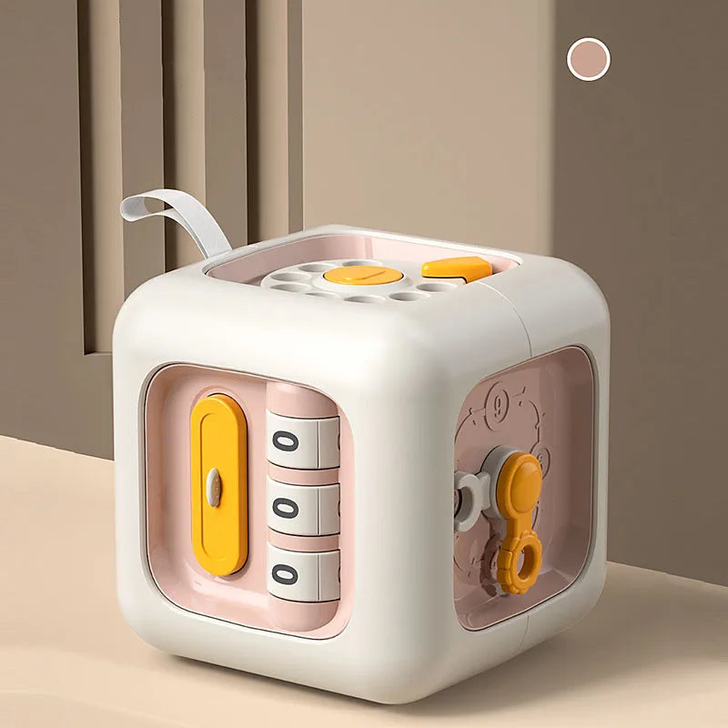 A white Montessori pop-up animal toy with a pink interior and yellow accents, designed as an interactive hide and seek sensor