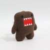A brown, fuzzy plush charm shaped like a monster with a red and white toothy grin.