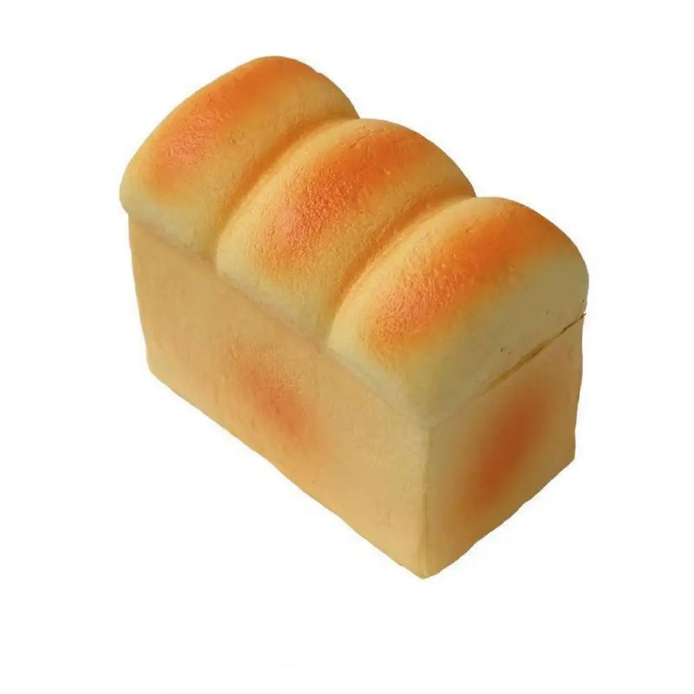 A loaf of bread shaped like a squeeze toy with three raised sections for sensory play.