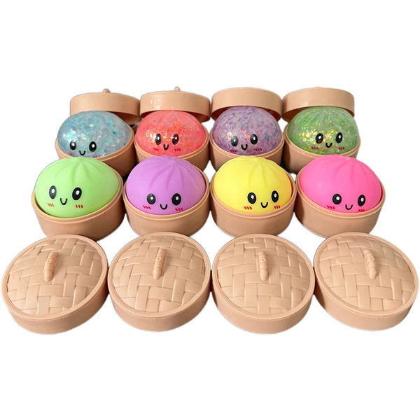 A set of ten colorful glitter squishy dumpling sensory toys in various pastel colors.