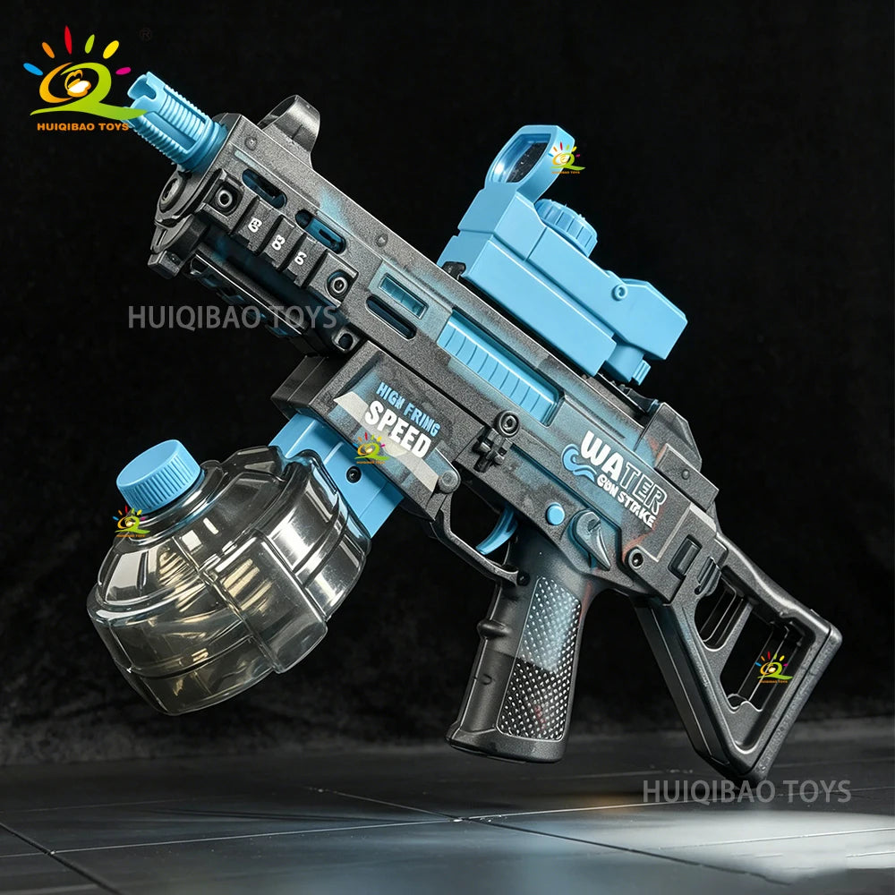 A grey and blue automatic electric UMP45 water blaster rifle is shown in a dynamic pose against a dark background.