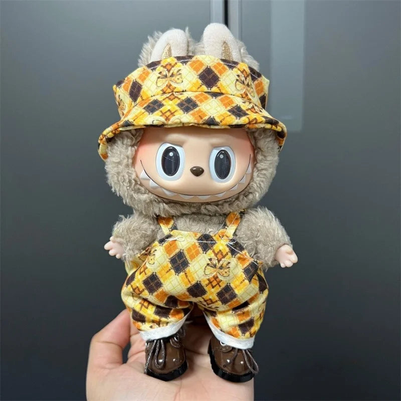 Labubu doll wearing a yellow and brown plaid outfit with a matching hat