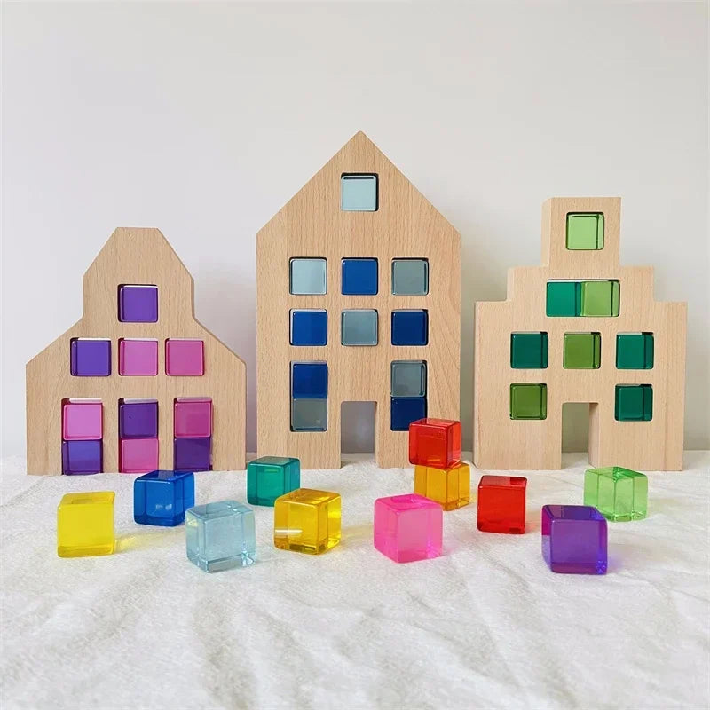 Wooden building blocks shaped like houses in various colors including purple, blue, green, and yellow.
