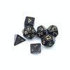 A set of seven black polyhedral dice showing various numbers and shapes.