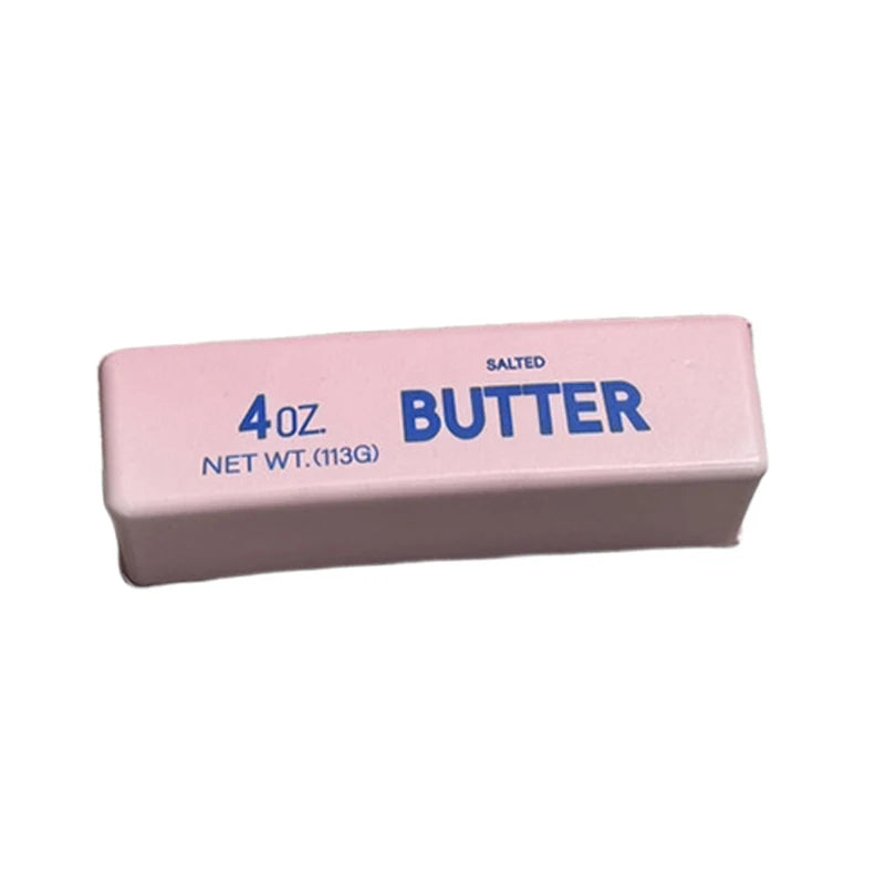 A pink butter squishy product labeled 4oz salted butter with a net weight of 113g