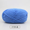 A ball of light blue pre-dyed milk cotton yarn used for knitting and crochet.
