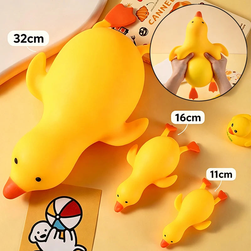 A yellow jumbo duck squishy stress relief toy shown in various sizes and a close-up of the product.