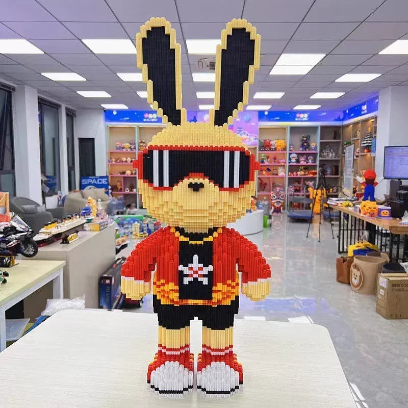 A fully assembled cute bear and rabbit character made from yellow building blocks.