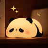 A glowing white silicone panda night light with black ears and eyes, featuring sparkling star accents.