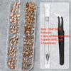A clear plastic kit containing various colored rhinestones, a point drill pen, and tweezers for nail art.