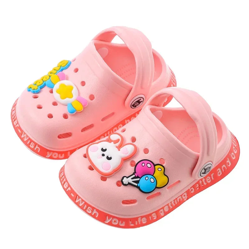 Pink lightweight children's clogs with yellow and blue decorations for summer fun