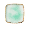 A square resin nail art palette with a pale mint green color and a gold textured trim.
