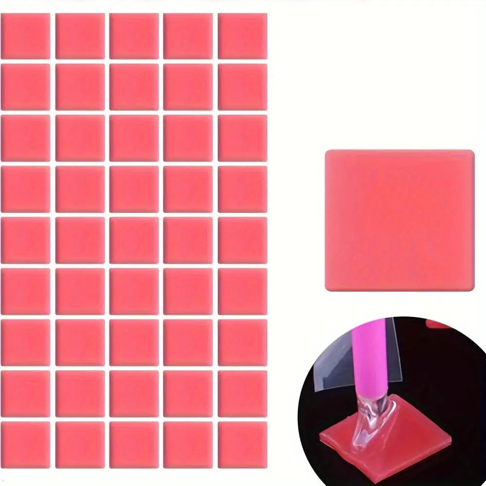 A grid of 80 pink silicone putty pieces for diamond painting or rhinestone application, with a single piece shown on a red ba