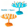 A set of frog balance tree math game pieces in orange and blue plastic.