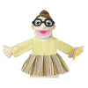 A plush hand puppet of a girl with brown hair, glasses, and a yellow top and striped skirt.