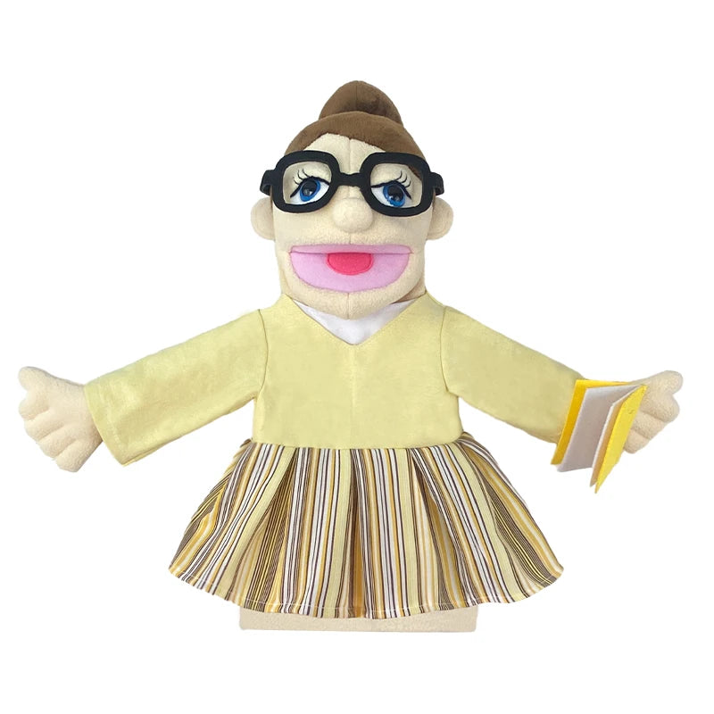 A plush hand puppet of a girl with brown hair, glasses, and a yellow top and striped skirt.