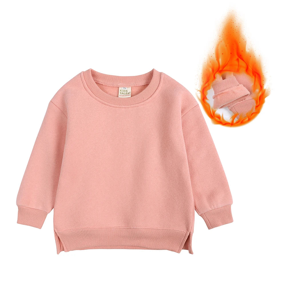 A pink kids pullover hoodie with a hood and a small orange flame graphic.