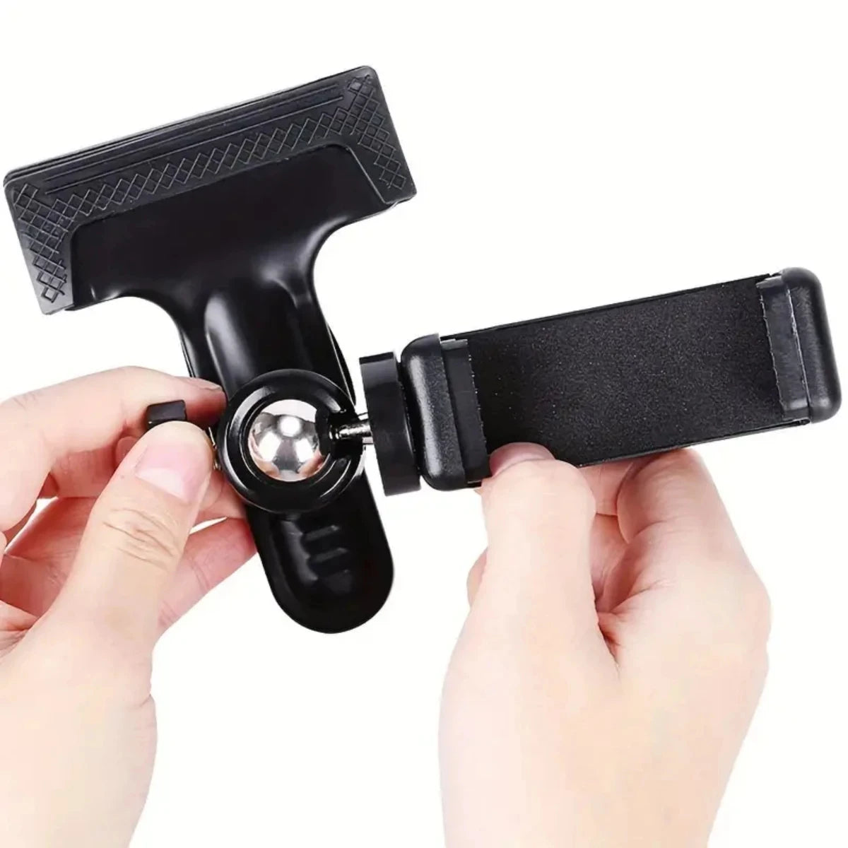 A hand is holding a black 360° rotating guitar phone mount for live streaming and recording.