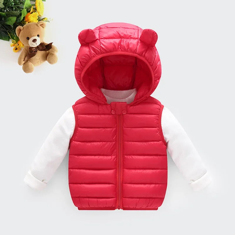 A red quilted hooded vest for children, worn over a white long-sleeved shirt.