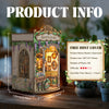 A wooden miniature kit of Monet's Studio featuring an ornate facade and detailed interior scenes.
