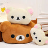 A soft plush hand rest pillow featuring two bear-like characters, one white and one brown.