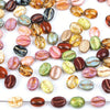 A collection of colorful, polished coffee bean beads in various shades and textures for jewelry making.