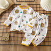 White long sleeve cotton pajama set for kids featuring lion and star patterns