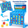 A blue storage box shaped like a game table holding colorful bouncing balls for a game.