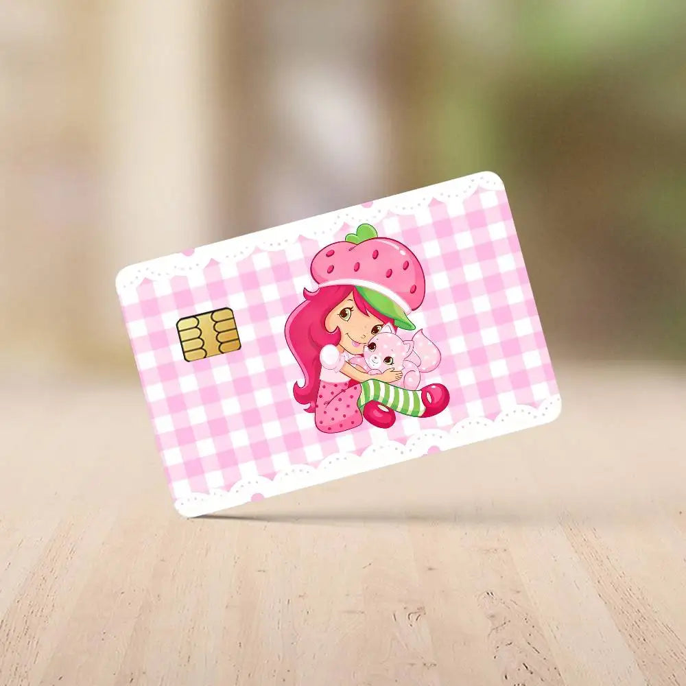 A pink and green strawberry shortcake cartoon design on a white checkered card sticker set.