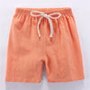 Orange linen shorts for kids with an adjustable elastic waist