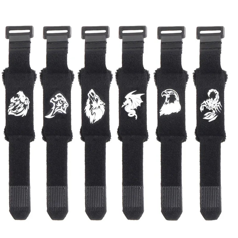 A set of black guitar string dampeners with adjustable tension.
