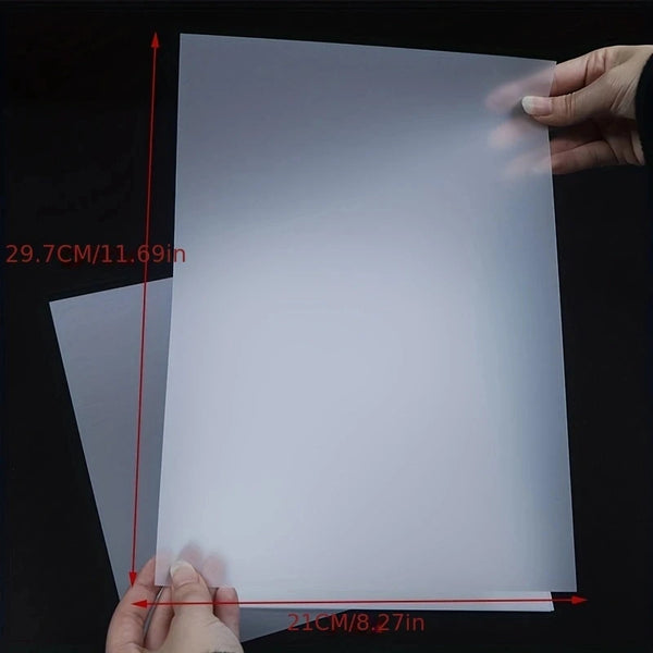 Film de transferencia DTF A4 blanco medido a mano, mostrando sus dimensiones.