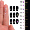 A collection of various size and colored glass crystal flatback rhinestones for nail art, displayed next to a ruler.
