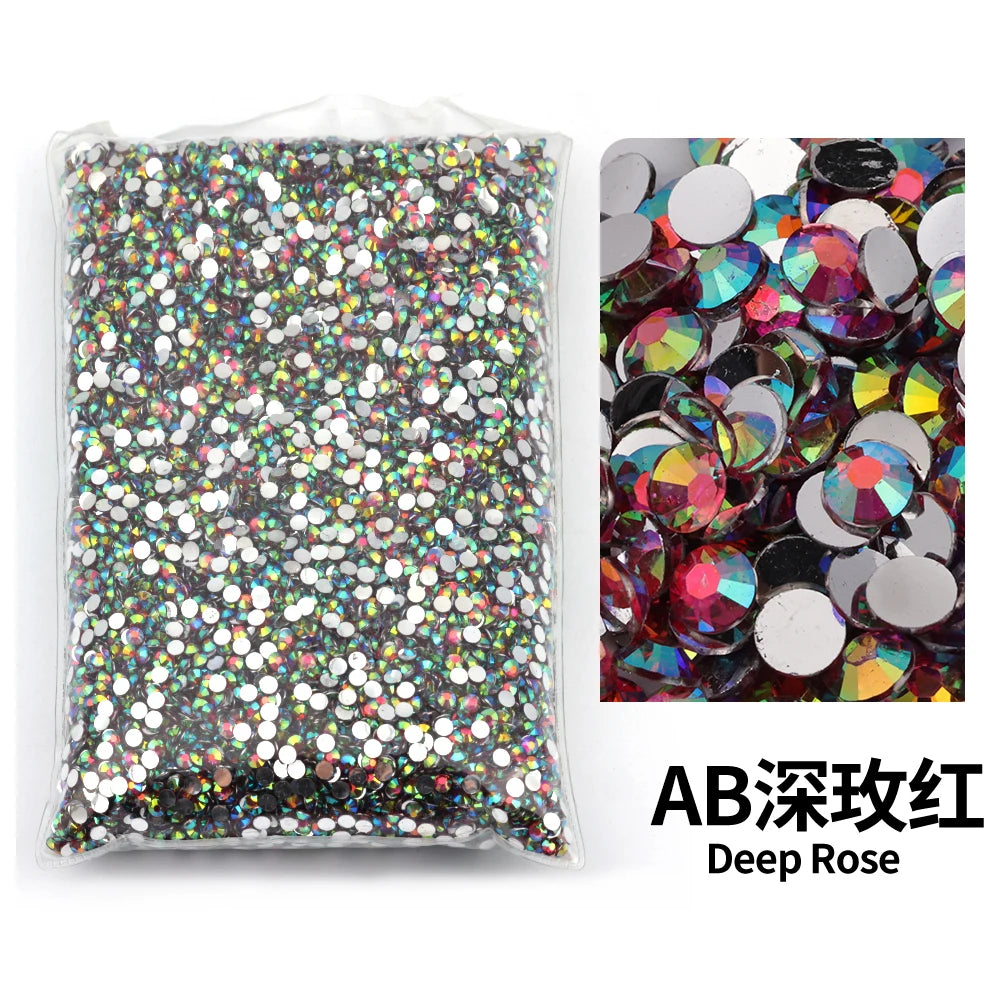 Bag of deep rose colored resin rhinestones for DIY craft and nail art