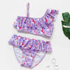Girls' two-piece rainbow swimsuit set featuring purple fabric with pink and white floral patterns