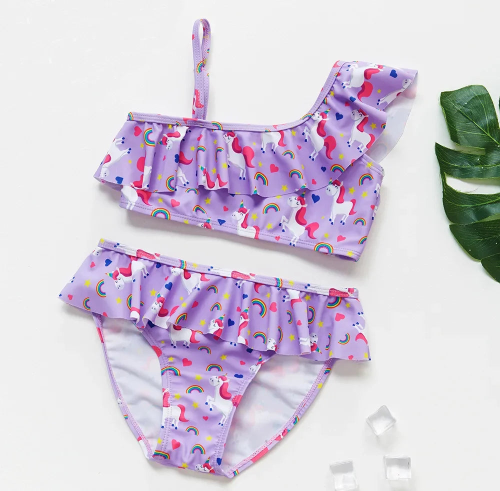 Girls' two-piece rainbow swimsuit set featuring purple fabric with pink and white floral patterns
