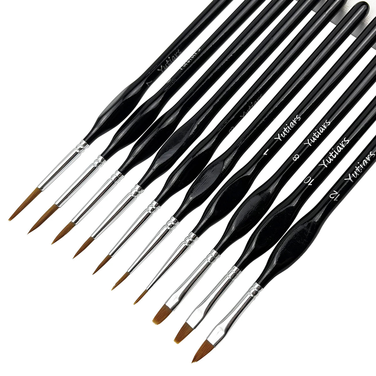 A set of thirteen fine detail paint brushes with black handles and silver tips arranged diagonally.