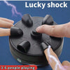 A hand is playing a black electric shock game with lightning effects, demonstrating the lucky shock party game.