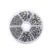 A circular plastic tray divided into six sections holding various jewelry making components like clasps, jump rings, and crim