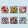 A collection of three floral paintings in various colors and styles, featuring roses, sunflowers, and other blooms.