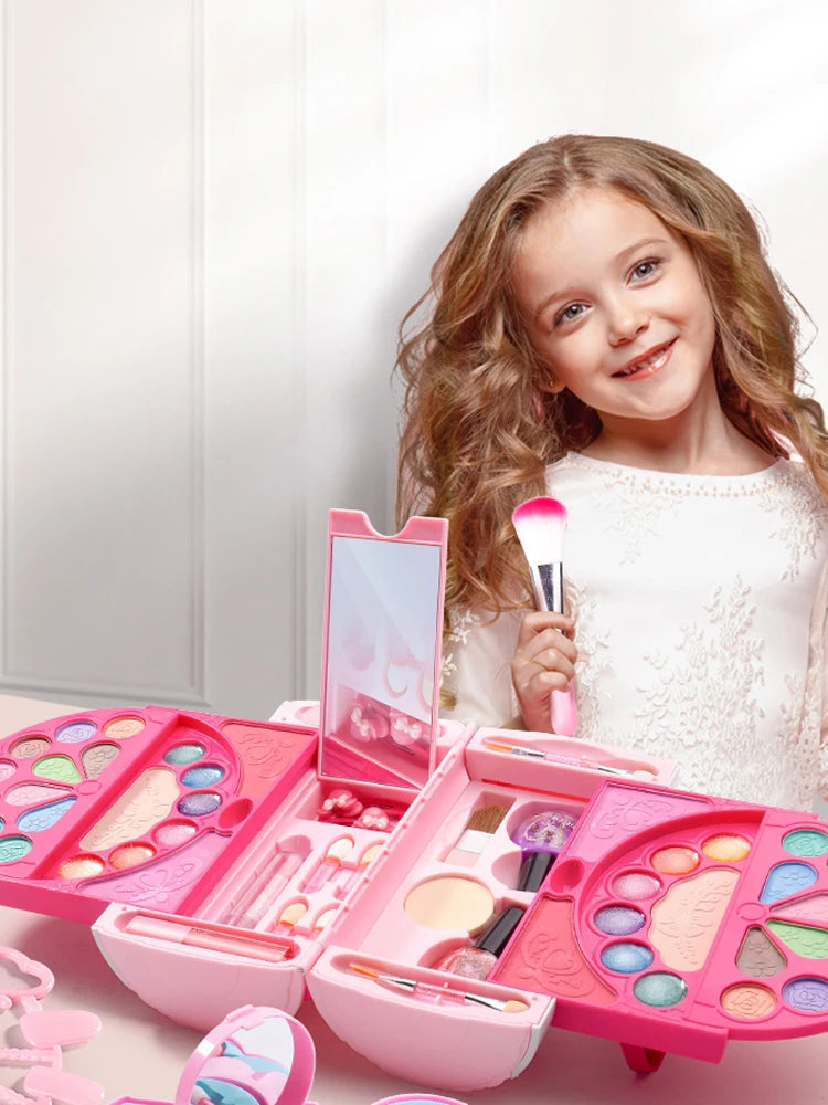 A smiling girl holds a pink makeup kit with various cosmetic tools and palettes for pretend play.