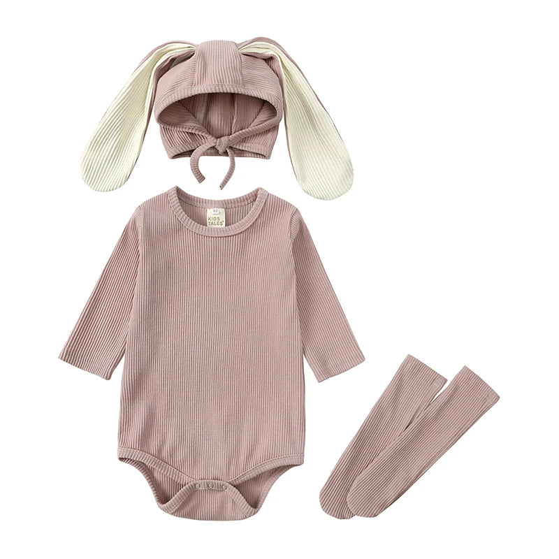 A mauve rabbit romper set for babies includes a matching hat and socks.