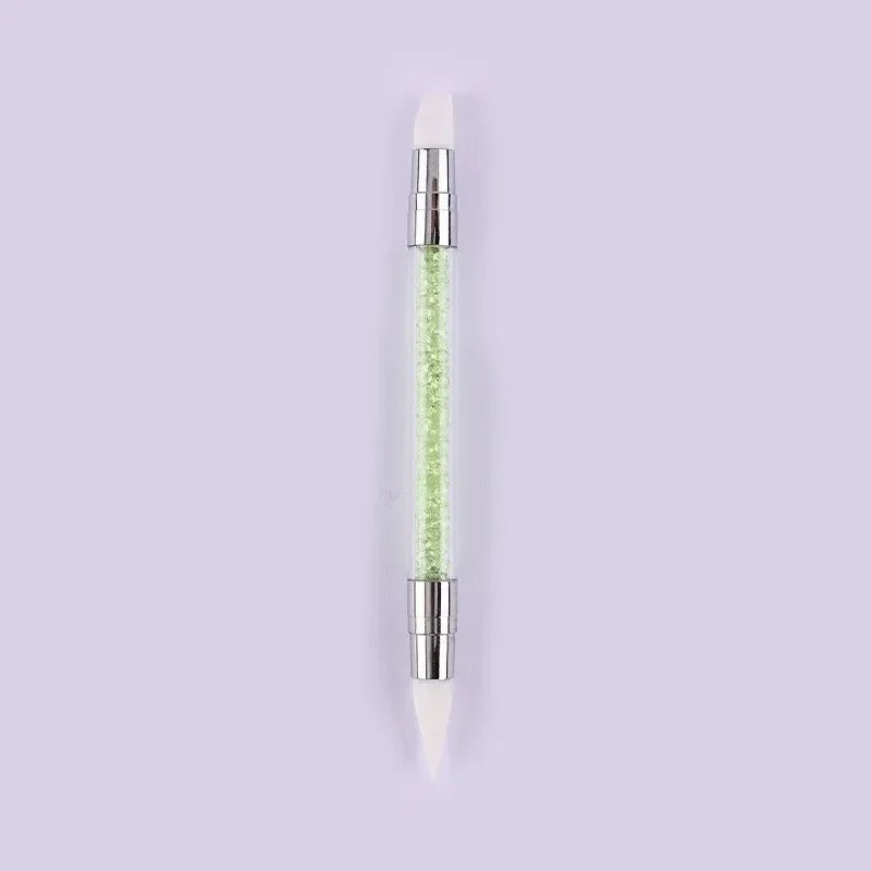 A dual-ended silicone head nail art dotting pen with a crystal handle.