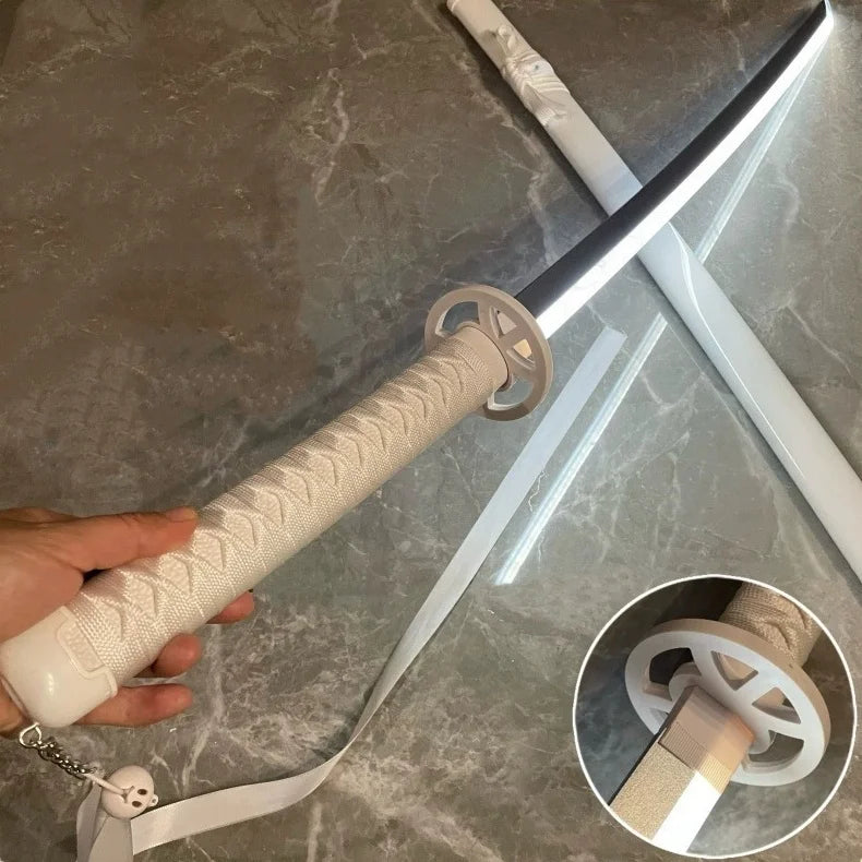 A hand holds a luminous anime katana prop with an LED blade and a textured grip against a marbled background.