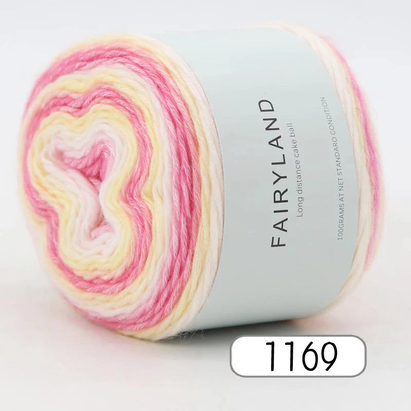 Roll of gradient rainbow yarn labeled Fairyland 100 grams at net standard condition