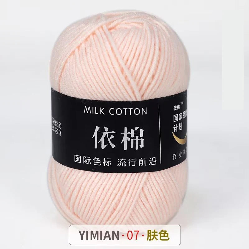 A ball of pink milk cotton yarn labeled YIMIAN 07 Pink for knitting and crochet