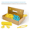 A cardboard box containing yellow and blue felt tool boxes and a yellow cutting tool.